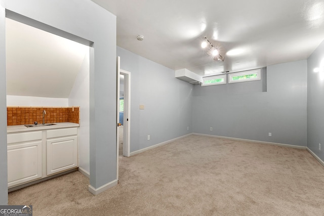 733 Miller Run, Atlanta, GA 30349 - unfurnished living room featuring a sink and light colored carpet