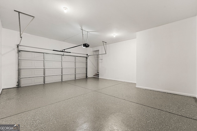 733 Miller Run, Atlanta, GA 30349 - garage with a garage door opener and baseboards