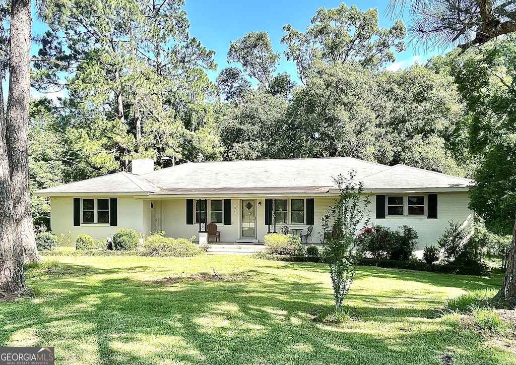 1794 Dames Ferry Rd, Forsyth, GA 31029 - single story home featuring covered porch, a front yard, and a chimney