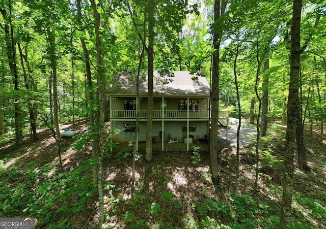 1203 Spring Cove Rd, Blairsville, GA 30512 - back of house with a deck, a forest view, and a shingled roof