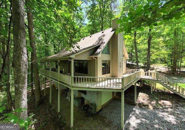 1203 Spring Cove Rd, Blairsville, GA 30512 - back of property with stairway, a chimney, a wooden deck, and roof with shingles