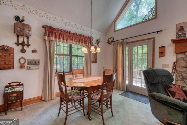 1203 Spring Cove Rd, Blairsville, GA 30512 - dining room with light carpet, a chandelier, and high vaulted ceiling