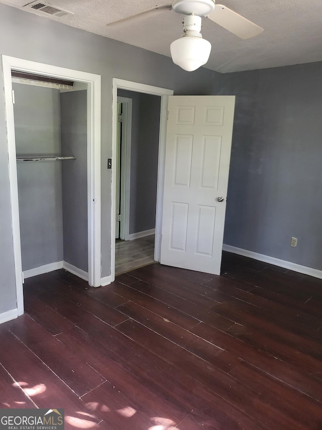 4274 W Oak Dr, Macon, GA 31210 - unfurnished bedroom with hardwood / wood-style flooring, a closet, and ceiling fan