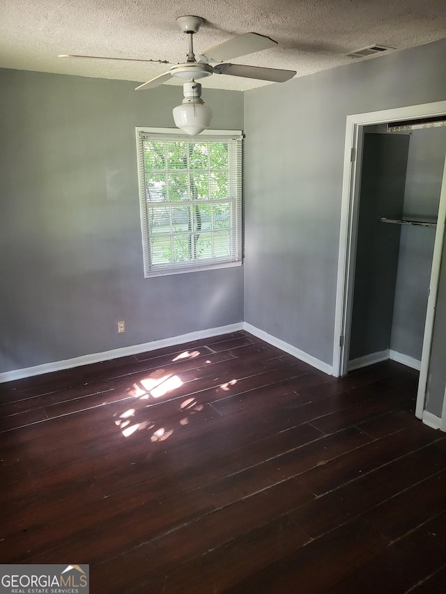 4274 W Oak Dr, Macon, GA 31210 - unfurnished bedroom featuring hardwood / wood-style floors, a textured ceiling, and a ceiling fan