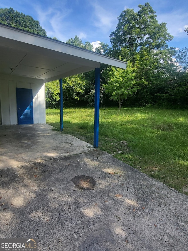 4274 W Oak Dr, Macon, GA 31210 - view of parking / parking lot featuring a carport