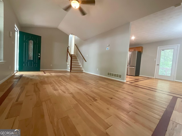 48 Glenhaven Ct, Douglasville, GA 30134 - unfurnished living room featuring a ceiling fan, light wood-type flooring, stairs, and lofted ceiling