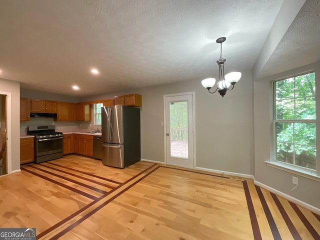 48 Glenhaven Ct, Douglasville, GA 30134 - kitchen with stainless steel appliances, under cabinet range hood, healthy amount of natural light, light countertops, and recessed lighting