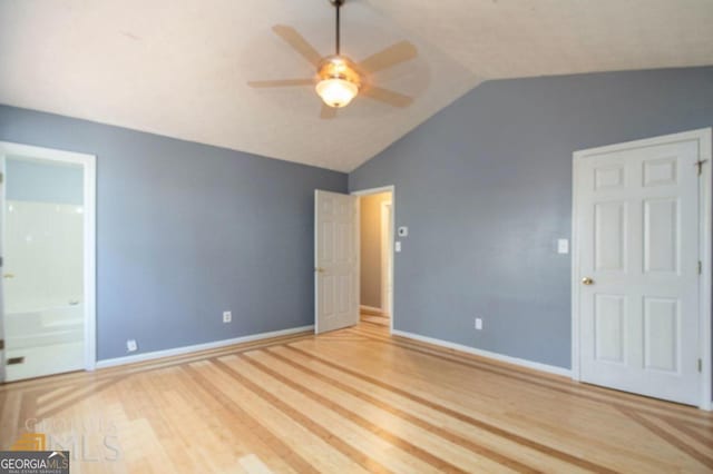 48 Glenhaven Ct, Douglasville, GA 30134 - unfurnished bedroom featuring lofted ceiling, wood finished floors, connected bathroom, and a ceiling fan