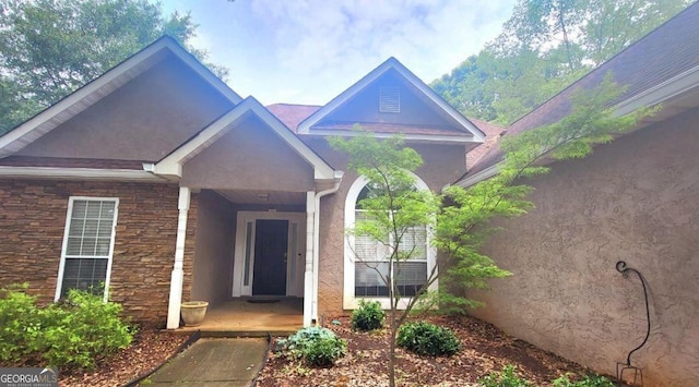 455 Old Ivy Path, Mcdonough, GA 30253 - view of exterior entry featuring stone siding and stucco siding