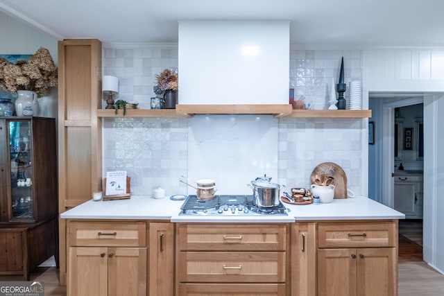 8815 Campbellton St, Douglasville, GA 30134 - kitchen with tasteful backsplash, crown molding, open shelves, light wood-style flooring, and light countertops