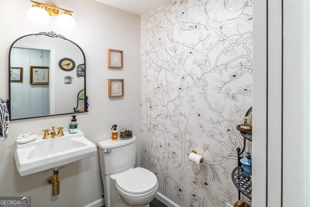 8815 Campbellton St, Douglasville, GA 30134 - bathroom featuring toilet and a sink