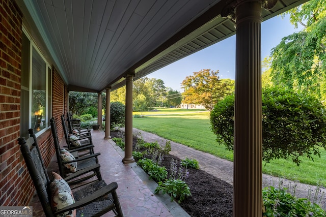 8815 Campbellton St, Douglasville, GA 30134 - covered porch featuring a yard