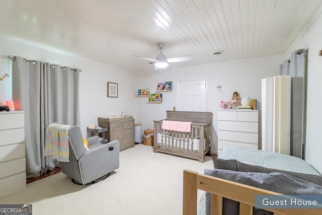 8815 Campbellton St, Douglasville, GA 30134 - carpeted bedroom with a nursery area, ceiling fan, and wooden ceiling