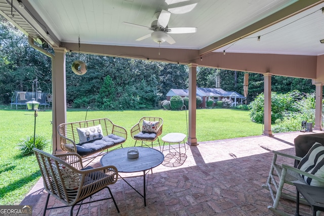 8815 Campbellton St, Douglasville, GA 30134 - view of patio / terrace with ceiling fan, a trampoline, and view of wooded area