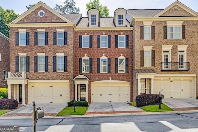 4742 Legacy Cove Ln, Smyrna, GA 30126 - view of front of home featuring driveway, brick siding, and a garage