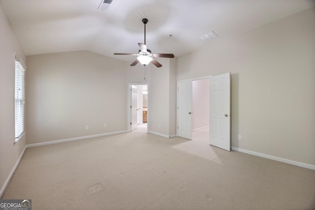 4742 Legacy Cove Ln, Smyrna, GA 30126 - unfurnished bedroom with lofted ceiling, light colored carpet, ceiling fan, and connected bathroom