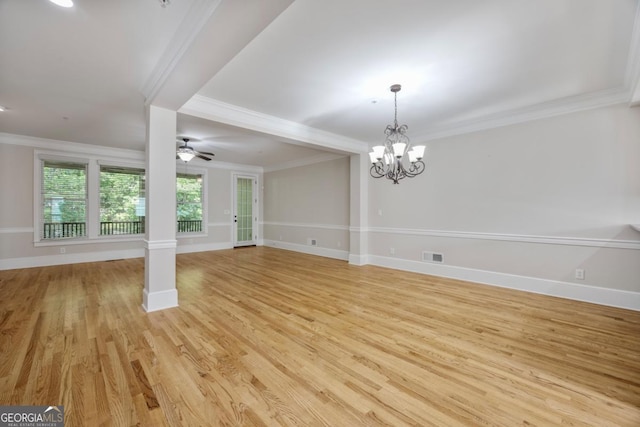 4742 Legacy Cove Ln, Smyrna, GA 30126 - empty room featuring light wood-type flooring, crown molding, a chandelier, and a ceiling fan