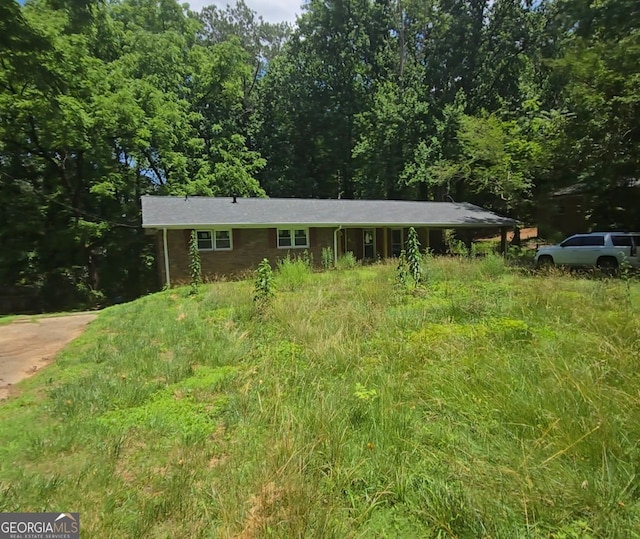 5533 Glore, Mableton, GA 30126 - view of front facade featuring a forest view