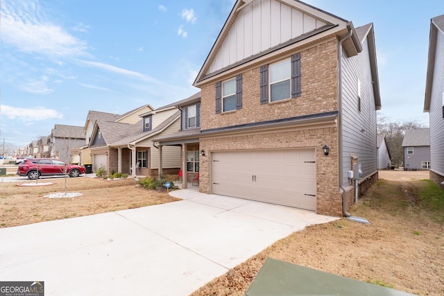 2277 Church St, Hampton, GA 30228 - view of front of house with brick siding, board and batten siding, a garage, driveway, and a residential view