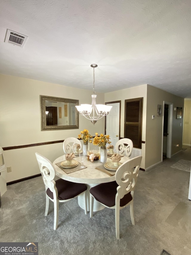 110 Waverly Way, Lagrange, GA 30240 - carpeted dining room with baseboards and a chandelier