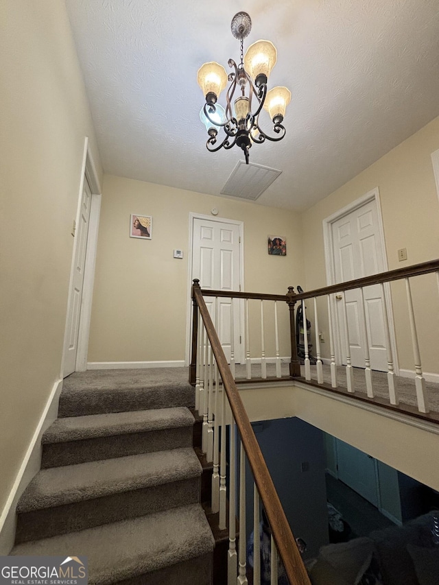 110 Waverly Way, Lagrange, GA 30240 - staircase with a chandelier and carpet floors
