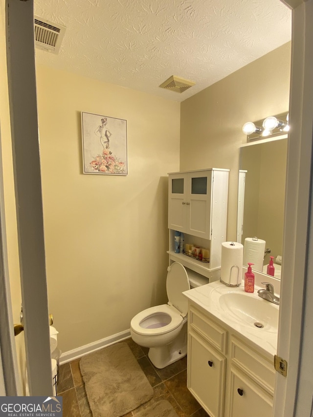 110 Waverly Way, Lagrange, GA 30240 - half bath with vanity and a textured ceiling
