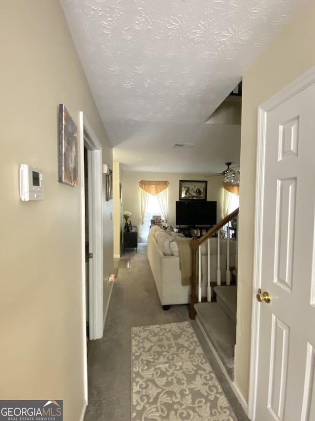 110 Waverly Way, Lagrange, GA 30240 - hall with carpet floors, a textured ceiling, and stairs