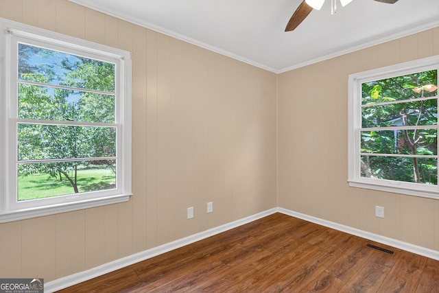 116 Preston Pl, Lagrange, GA 30241 - spare room featuring dark wood-style floors, a ceiling fan, plenty of natural light, and ornamental molding
