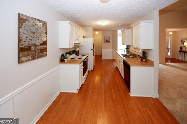 555 Flintlock Dr, Dacula, GA 30019 - kitchen featuring white appliances, light wood finished floors, light countertops, a textured ceiling, and white cabinets