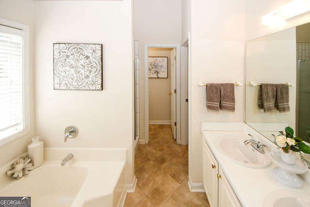 555 Flintlock Dr, Dacula, GA 30019 - bathroom with a bath, double vanity, and a stall shower