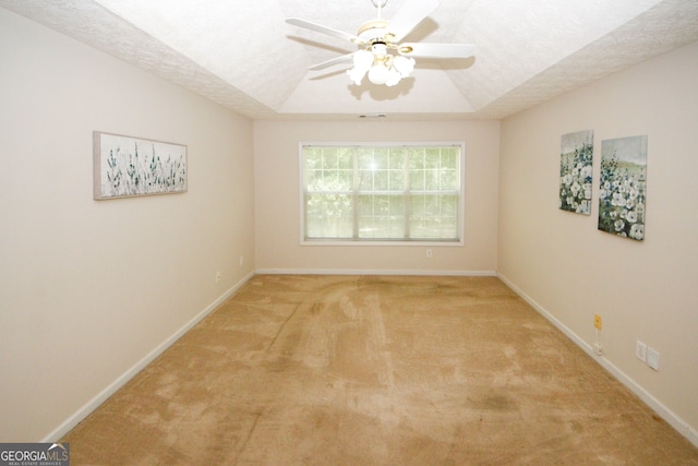 555 Flintlock Dr, Dacula, GA 30019 - empty room with carpet, a tray ceiling, ceiling fan, and a textured ceiling
