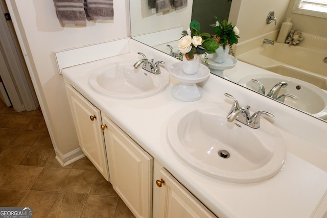555 Flintlock Dr, Dacula, GA 30019 - full bathroom with double vanity, tile patterned flooring, and a tub