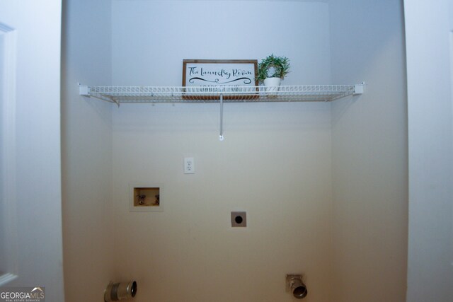 555 Flintlock Dr, Dacula, GA 30019 - laundry room featuring hookup for an electric dryer and washer hookup