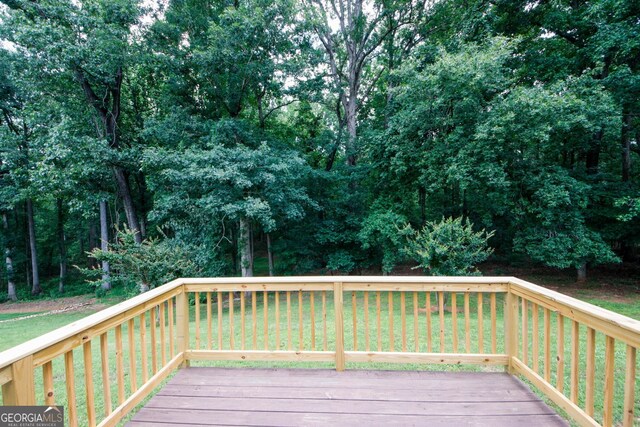 555 Flintlock Dr, Dacula, GA 30019 - deck featuring a lawn