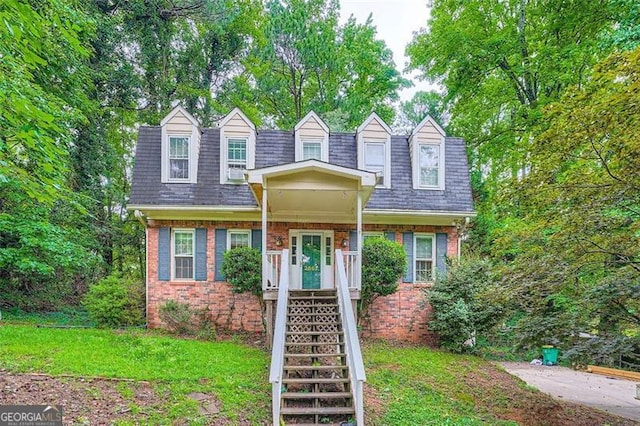 2867 Holly Oaks Dr, Marietta, GA 30062 - cape cod house with brick siding, mansard roof, roof with shingles, and a front yard