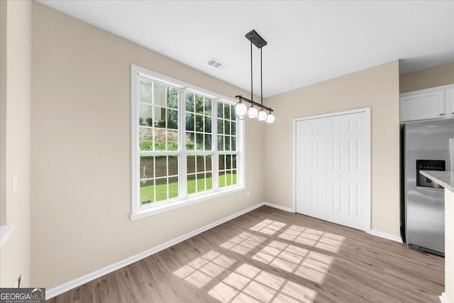 3559 Reservoir Pass, Acworth, GA 30101 - unfurnished dining area with light wood-type flooring and healthy amount of natural light