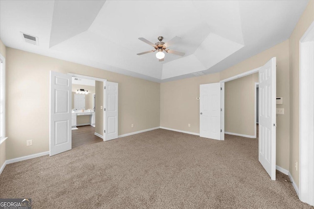 3559 Reservoir Pass, Acworth, GA 30101 - unfurnished bedroom with carpet flooring, a raised ceiling, connected bathroom, and a ceiling fan
