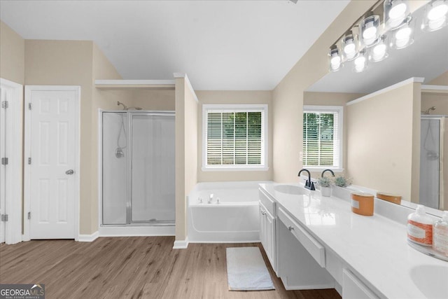 3559 Reservoir Pass, Acworth, GA 30101 - bathroom featuring a stall shower, wood finished floors, a bath, and double vanity