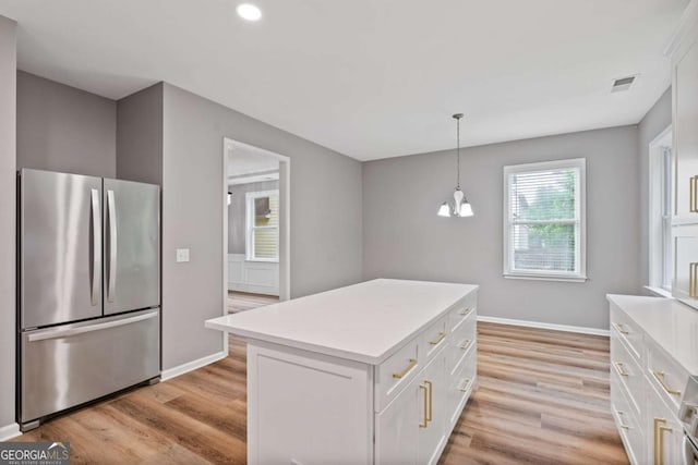 950 Mill Creek Ave, Canton, GA 30115 - kitchen featuring freestanding refrigerator, light wood-type flooring, white cabinets, light countertops, and recessed lighting