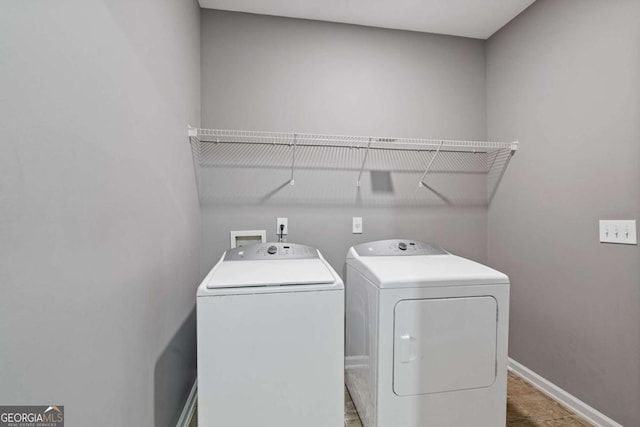 950 Mill Creek Ave, Canton, GA 30115 - laundry room with washing machine and clothes dryer and baseboards