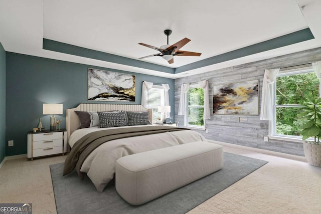 950 Mill Creek Ave, Canton, GA 30115 - carpeted bedroom featuring a tray ceiling, multiple windows, and ceiling fan