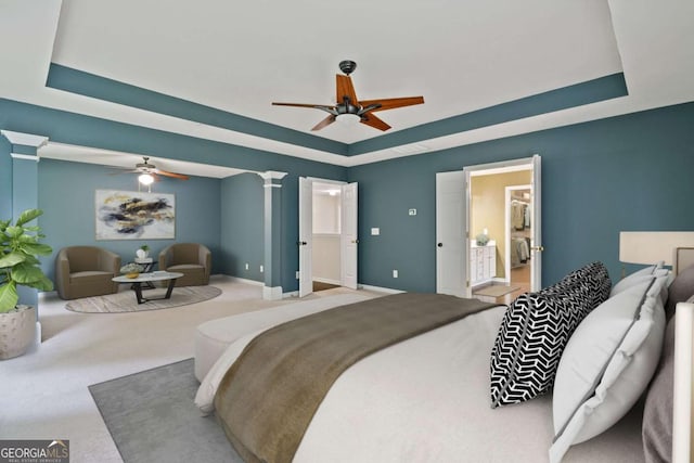 950 Mill Creek Ave, Canton, GA 30115 - carpeted bedroom featuring a raised ceiling, a ceiling fan, and decorative columns
