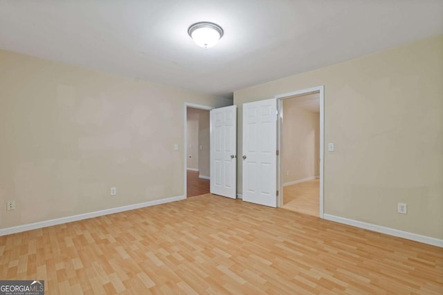 950 Mill Creek Ave, Canton, GA 30115 - unfurnished bedroom featuring light wood finished floors and baseboards