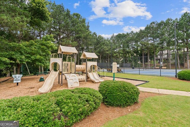 950 Mill Creek Ave, Canton, GA 30115 - community jungle gym featuring view of wooded area and a tennis court
