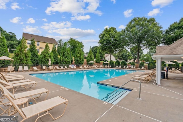950 Mill Creek Ave, Canton, GA 30115 - community pool with a patio area and view of scattered trees