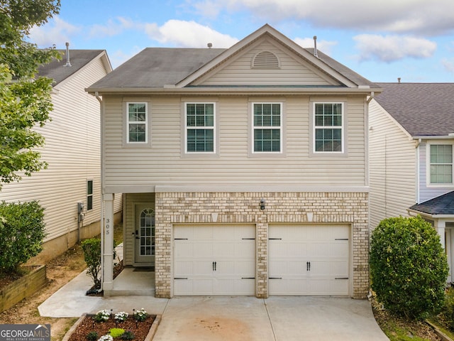 305 Hidden Creek Ln, Canton, GA 30114 - traditional home with an attached garage and concrete driveway