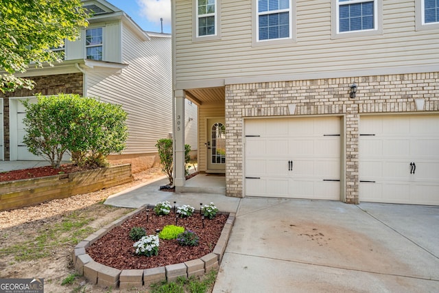 305 Hidden Creek Ln, Canton, GA 30114 - entrance to property with concrete driveway and a garage