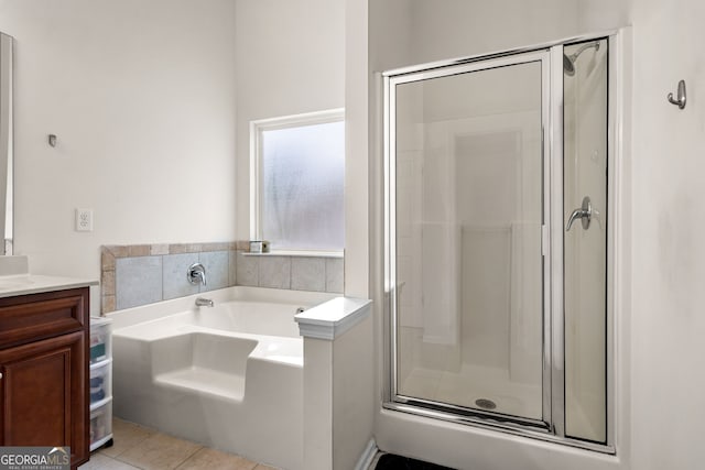 305 Hidden Creek Ln, Canton, GA 30114 - bathroom featuring a shower stall, vanity, a bath, and tile patterned floors
