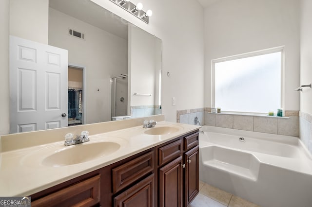 305 Hidden Creek Ln, Canton, GA 30114 - bathroom with tile patterned flooring, double vanity, a garden tub, and a stall shower