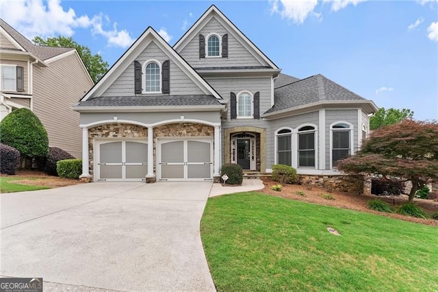 3311 Marina View Way, Gainesville, GA 30506 - view of front of house with driveway, a front yard, roof with shingles, and stone siding